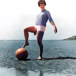 Woman on beach with ball Woman on beach with ball