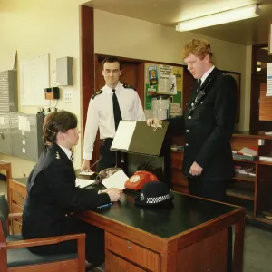 Woman police officer and two male colleagues Woman police officer and two male colleagues