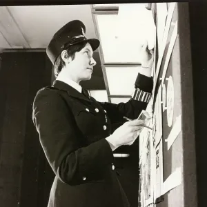 Woman police officer at work in a London police station Woman police officer at work in a London police station