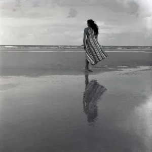 Woman on a twilight beach Woman on a twilight beach