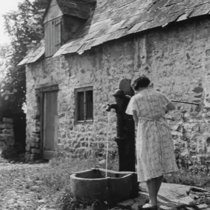 Woman using water pump Woman using water pump