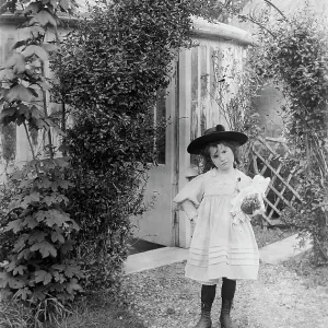 YOUNG GIRL IN GARDEN YOUNG GIRL IN GARDEN