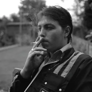 Young man smoking a cigarette Young man smoking a cigarette