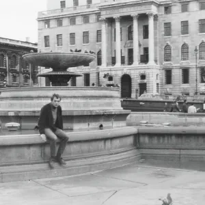 Young man in Trafalgar Square, London Young man in Trafalgar Square, London