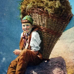 Young Swiss boy - backpack filled with hay Young Swiss boy - backpack filled with hay