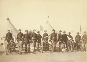 Encampments: 15 men of Battery E, 1st Artillery, posed with three
