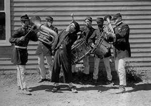Tubas: 1910s 1920s funny intoxicated man singing surrounded