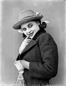 Coquette: 1910s 1920s smiling flirting young girl looking