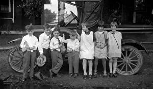 Lef001: 1910s CHILDREN LINED UP IN FRONT OF TRUCK FACING