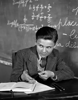 Fraction: 1920s 1930s Boy At Desk In Classroom