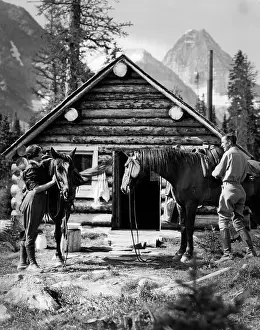 Jodhpurs: 1920s 1930s COUPLE IN FRONT OF LOG CABIN STANDING