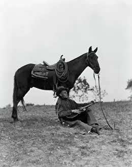 Westerns: 1920s 1930s Cowboy Sitting Against