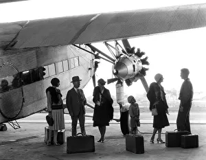 Monoplanes: 1920s 1930s GROUP OF PASSENGERS STANDING UNDER