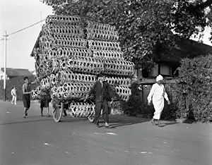 Outsized: 1920s 1930s Man Pulling Cart Piled