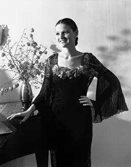 Dressy: 1920s 1930s SMILING WOMAN POSING BY TABLE WITH