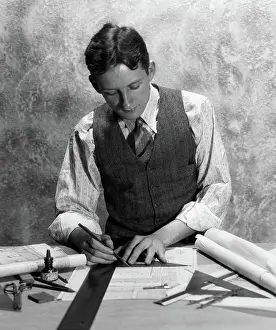 Drafting: 1920s 1930s YOUNG MAN AT DESK DRAFTING WITH TRIANGLE