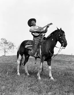 Strum: 1920s Cowboy On Horse Singing