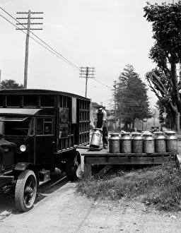 Milkmen: 1920s Delivery Man Unloading Milk