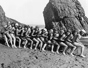Spooning: 1920's line of women spooning on the beach
