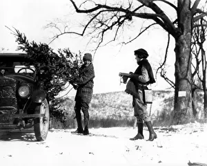 Retro Christmas: 1920s Man Loading Christmas Tree