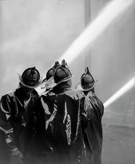 Slickers: 1920s Rear View Of Four Firemen