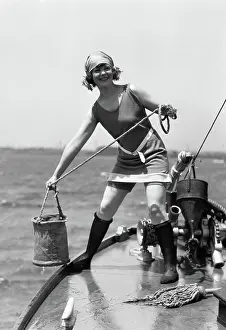 Grownups: 1920s WOMAN IN BATHING SUIT PULLING BUCKET OF