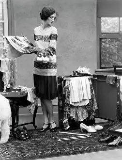 Unpacking: 1920s Woman Packing Clothes For