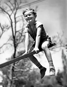 Teeter: 1930s 1940s BOY ON SEESAW SMILING