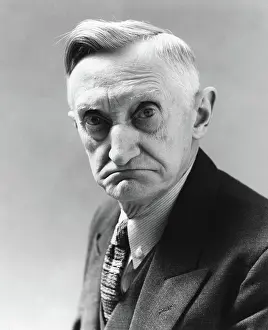 Dour: 1930s 1940s senior elderly man with grim serious