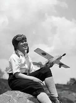 Skyward: 1930s BOY IN LEATHER AVIATOR CAP WITH GOGGLES