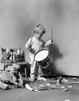 Banging: 1930s Boy In Pajamas Surrounded