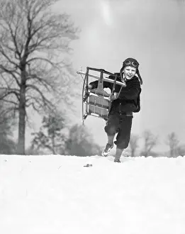 Flop: 1930s BOY WEARING AVIATOR CAP RUNNING THROUGH