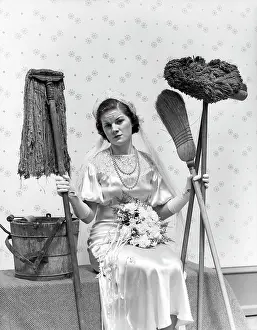 Mops: 1930s Bride Seated Next To Bucket