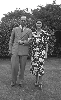 C1938: 1930s couple in the garden