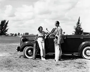 Desoto: 1930s Couple Leaning On Convertible
