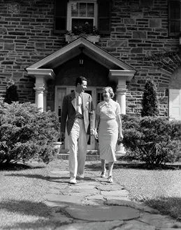 Romantics: 1930s Couple Walking Down Sidewalk