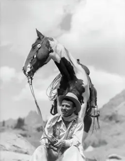 Dude: 1930s Cowboy Sitting In Front