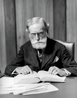 Dour: 1930s Elder Man In Glasses Sitting