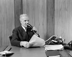 Dictation: 1930s Elderly Male Executive Sitting