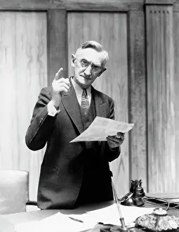 Desktop: 1930s Elderly Man In Office Standing