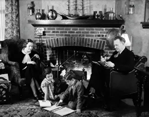 Schoolwork: 1930s FAMILY OF FOUR SITTING IN FRONT FIREPLACE