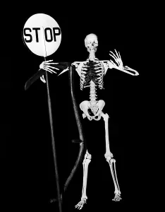 Chilling: 1930s full figure skeleton in black robe holding