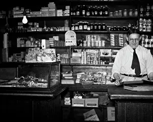 Merchandising: 1930s GENERAL STORE INTERIOR GROCER OWNER BEHIND