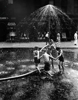 Hydrant: 1930s Inner City Children Playing In Spray From Fire Hydrant