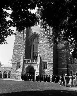 Campuses: 1930s Line Of Graduates Filing