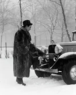 Stalled: 1930s Man In Hat And Raccoon