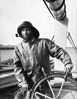 Souwester: 1930s Man At The Helm Wheel Of