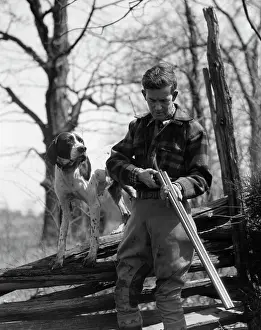 Gunning: 1930s Man Holding Double Barrel