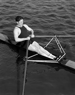 Sculling: 1930s Man Rowning Sculling Holding