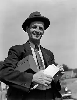 Businesspeople: 1930s Man In Suit & Hat With Lunch